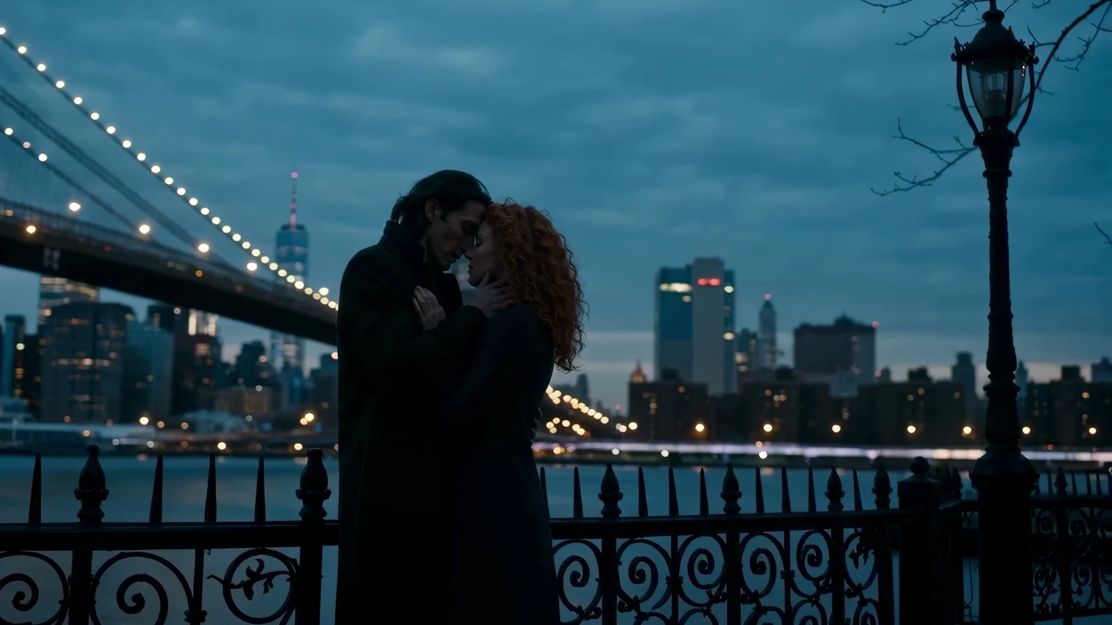 A graded night exterior from the film: a couple embracing on a walkway, the lit bridge and city skyline behind them in cool blue tones.